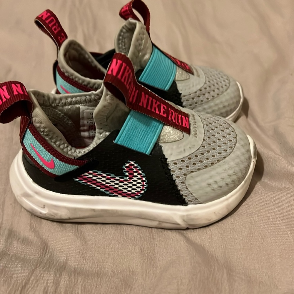 Used baby Nike slip on. Grey, teal and pink, in great condition size 4c